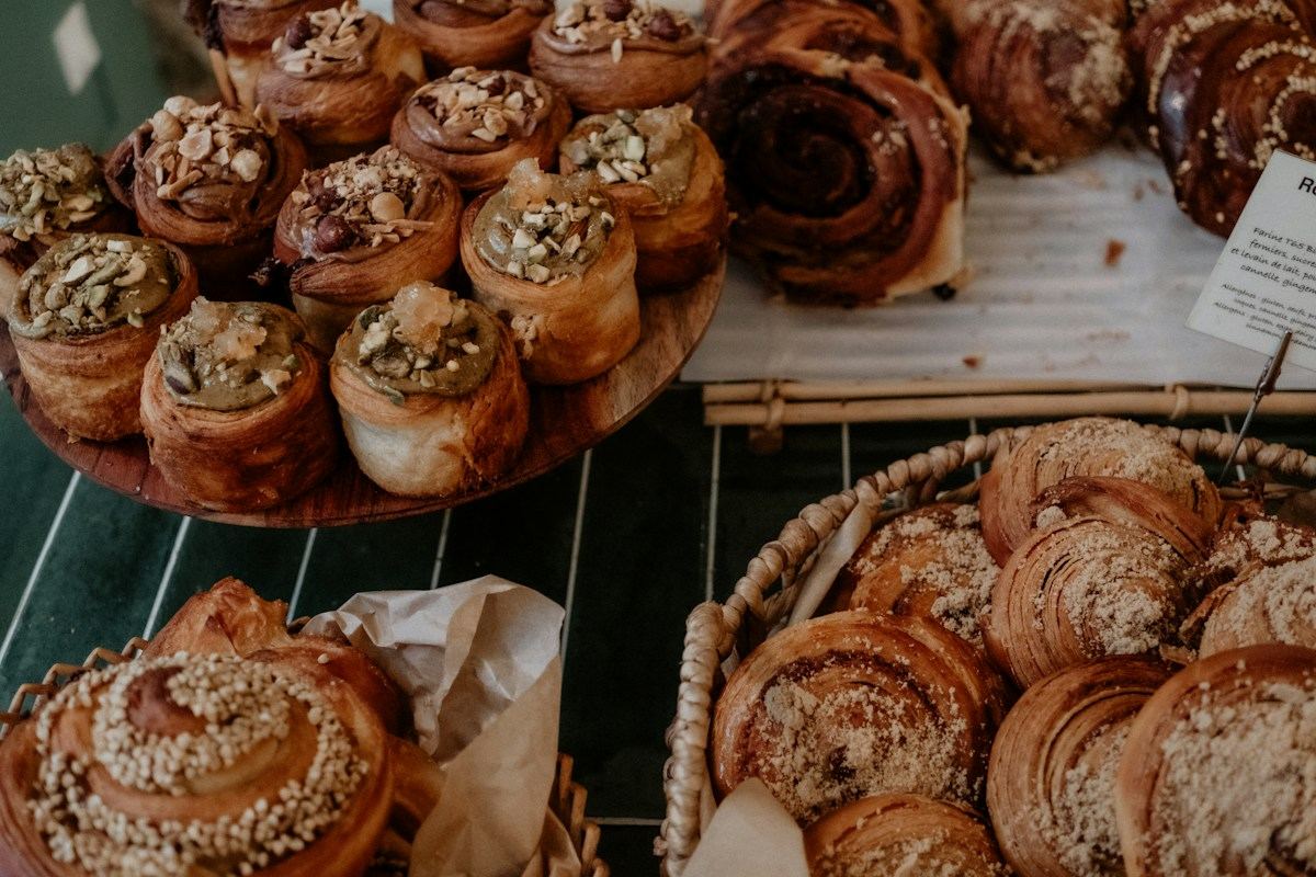 Trays of fresh cinnamon buns and pastries